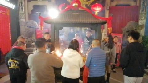 On New Year's Eve, people go to temples to burn incense and pray for blessings Stock Footage 300318732