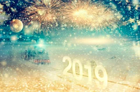 New Year's Eve with train and moon. Festive fireworks over the snow-covered p Foto stock