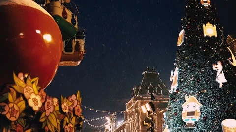 New Year's evening atmosphere on Red Square, GUM, Moscow, carousel, falling snow Stock Footage 211330554