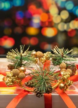 New Year's gift on the background of multi-colored blurred background. Stock Photos