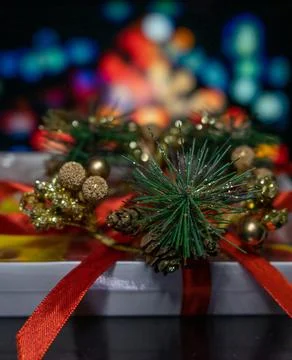 New Year's gift on the background of multi-colored blurred background Stock Photos