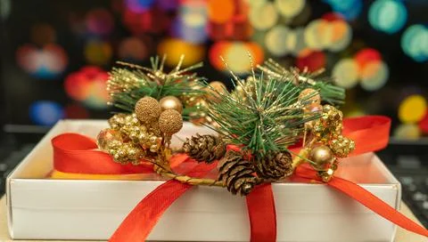 New Year's gift on the background of multi-colored blurred background Stock Photos
