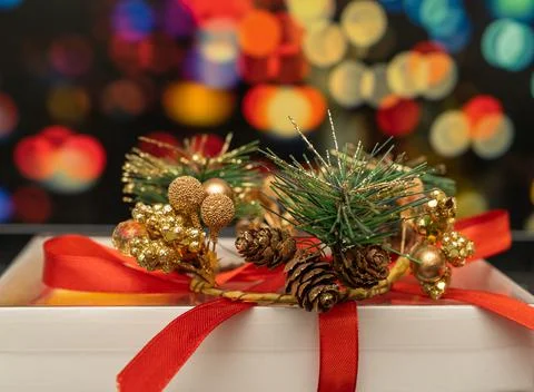 New Year's gift on the background of multi-colored blurred background Stock Photos