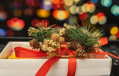 New Year's gift on the background of multi-colored blurred background Stock Photos