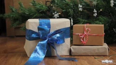 New Year's gifts under the tree. Gifts on the background of the New Year tree Stock Footage 144876012