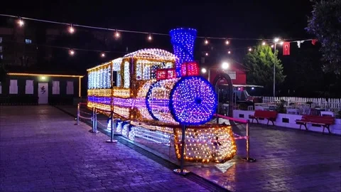 New Year's light installation in the form of a steam locomotive Stock Footage 320406504