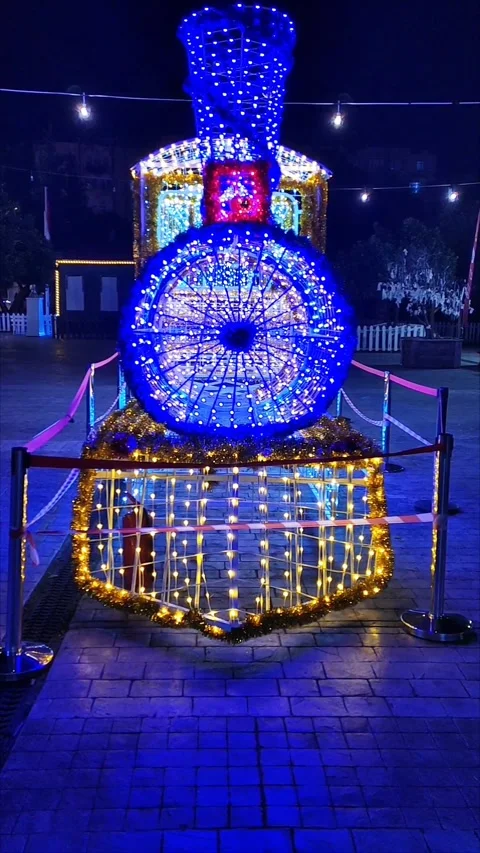 New Year's light installation in the form of a steam locomotive Stock Footage 320406505