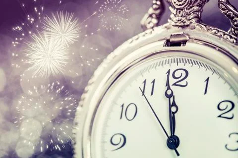 New Year's at midnight - Old clock and holiday lights Stock Photos