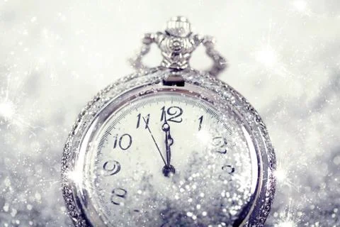 New Year's at midnight - Old clock and holiday lights Stock Photos