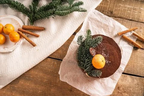 New Year's photo top view, the cake is on a wooden table, a spruce branch and Stock Photos