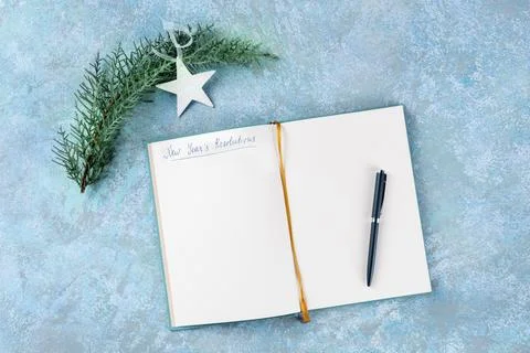 New Year's resolutions, flat lay top shot with a place for text, on a blue Stock Photos