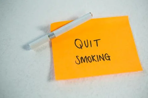 New years resolutions quit smoking with single cigarette Stock Photos