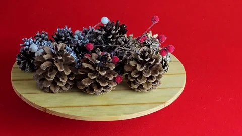 New Year's set for creativity. Cones, painted cones and rowan berries in glaze o Stock Footage 313884036