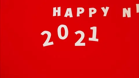 New Year's stop motion roller. New Year's content 2021 on red background. Stock Footage 143035495