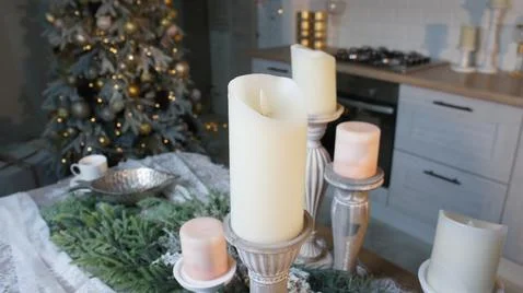 New Year's table, tablecloth, candles, coniferous branches Stock Photos