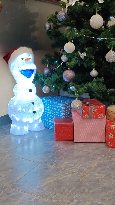New Year's tree, snowman, and gifts. Christmas decor. Stock Footage 321833846
