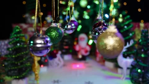 New Year's various decorations swing on a half-blurred Christmas background Stock Footage 255912626