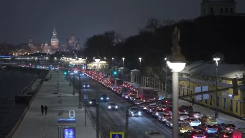 New Year's Winter traffic jam on the embankment against the background of the Stock Footage 166360910
