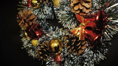 New Year's wreath handmade with pine cones and bows on door. Stock Footage 70813976