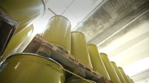 New yellow barrels inside a storage warehouse. Camera slider moving. Stock Footage 38613144