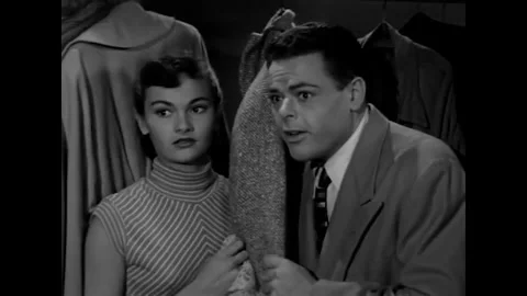 NEW YORK - 1952 - Two thieves hide inside a closet while a father and daughter Stock Footage 340653723