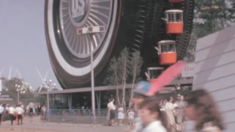 New York - 1964: Queue of people waits at US Royal tire-shaped Ferris wheel Stock Footage 170953440