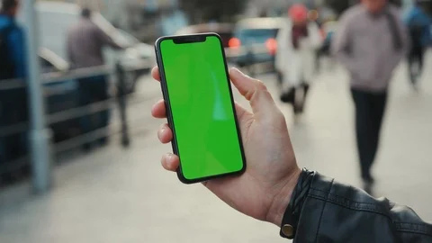 NEW YORK - April 5, 2018: Young man hands holding a smartphone with vertical Stock Footage 116570103
