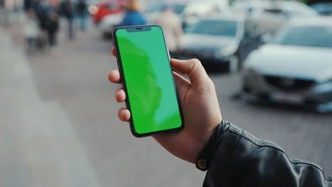 NEW YORK - April 5, 2018: Young man hands holding a smartphone with vertical Stock Footage 116570880