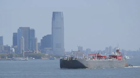 New York cargo ship in front of the liberty statue Stock Footage 63864790