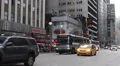 New York City Commuters Commuting Bus Passing Taxi Yellow Cab Rush Hour Busy NYC HD Footage