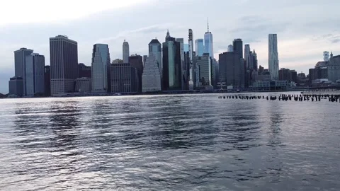 New York City downtown evening water bay pier moving buildings Stock Footage
