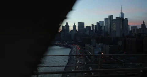 New York City downtown skyline evening from subway train Brooklyn bridge Stock Footage