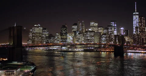 New York City evening night skyline buildings Brooklyn Bridge Stock Footage