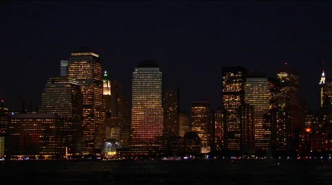 The New York City, NY skyline glows at night. Stock Footage