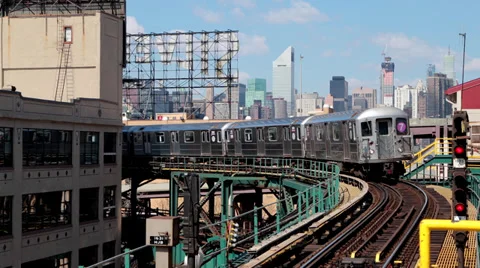 New York City skyline buildings and subway train running Stock Footage