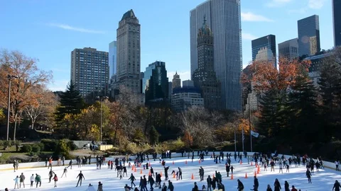 New York City Skyline with Central Park Ice Rink and People Skating Winter Sport Stock Footage