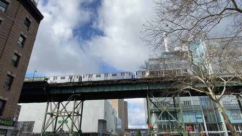 New York City subway on the elevated tracks in front of Columbia University Stock Footage 257945304