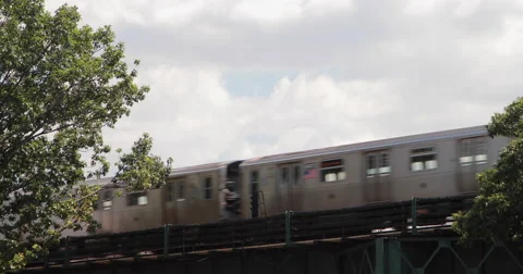 New York City subway train elevated in Queens 4k Stock Footage