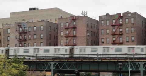 New York City subway train and Bronx apartment building 4k Stock Footage