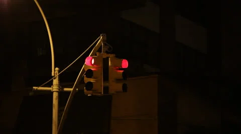 New York City traffic light at night - red to green Stock Footage