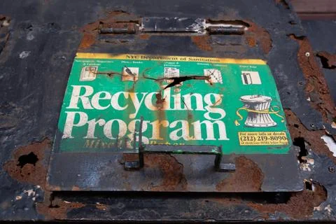 New York City, USA - July 1, 2019: old rusty recycling program trash containers Stock Photos