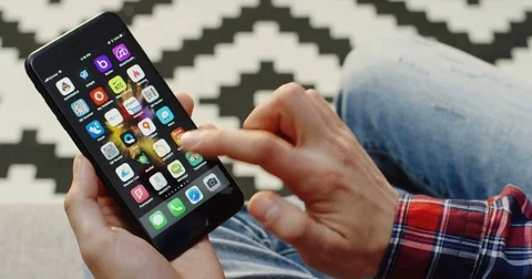 New York - Dec 01, 2017: Male hands holding vertically a black smartphone and Stock Footage 83049850