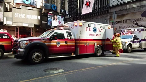 New York FD's Paramedics prepare stretcher trolleys to assist the injured Stock Footage