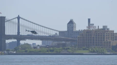 New York helicopter taking off in front of a bridge Stock Footage 63864243