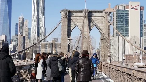 NEW YORK - JAN 15 Slow Motion Pedestrians walk over the Brooklyn Bridge Stock Footage 74642034