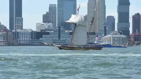 New York marks US Independence with naval parade and military air display, Nueva Video stock 338260543
