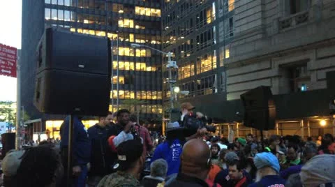 NEW YORK - MAY 1, 2012: An Occupy Wall Street Protestor talks about workers Stock Footage 11405850