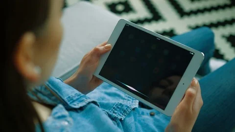 New York - May 15, 2017: young woman using Siri app on apple tablet device Stock Footage 76469812