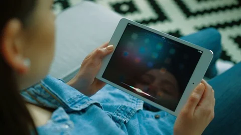 New York - May 15, 2017: young woman using Siri app on apple tablet device, ipad Stock Footage 76470596