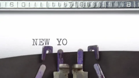 New York phrase closeup being typing and centered on a sheet of paper on old Stock Footage 230701711